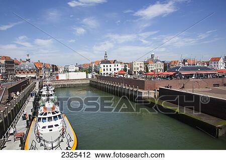 Stock Image - Netherlands, Zealand, Boats docked in harbour; Vlissingen. Fotosearch