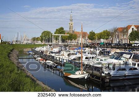 Stock Image - Netherlands, Zealand, Boats in harbour; Veere. Fotosearch