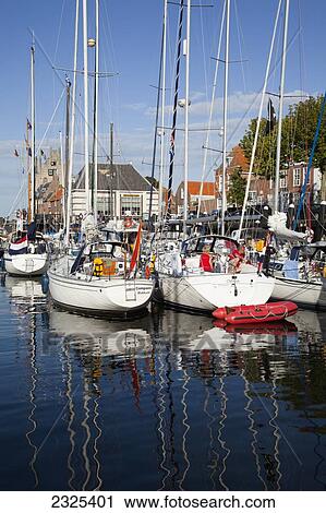 Stock Image - Netherlands, Zealand, Boats in harbour; Veere. Fotosearch