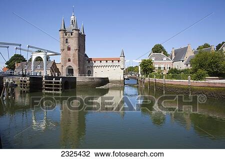 Stock Image - Netherlands, Zealand, Buildings along a harbor; Zierikzee. Fotosearch