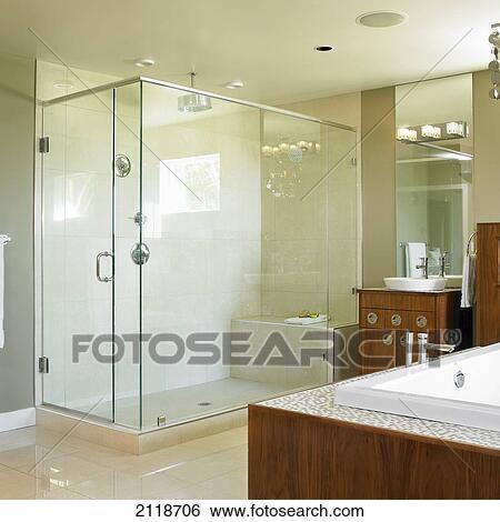 Neutral Modern Bathroom With Large Glass Shower And Wood Cabinets