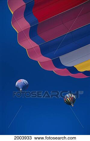 Stock Image - Nevada, Colorful Hot Air Balloons In Flight Against Blue Sky At Reno. Fotosearch