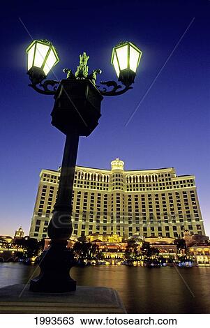 Nevada, Las Vegas, Bellagio/Nhotel And Casino, Old World Lamps Rim The Lagoon, Bright Lights Of Hotel View Large Photo Image Stock Image - Nevada, Las Vegas, Bellagio/Nhotel And Casino, Old World Lamps Rim The Lagoon, Bright Lights Of Hotel. Fotosearch
