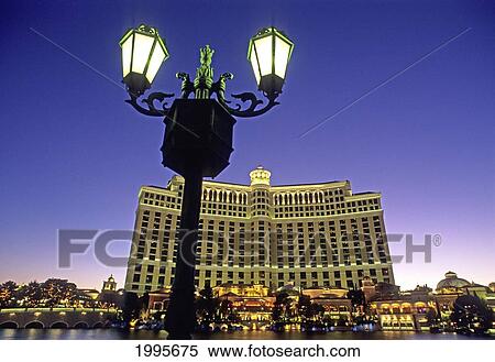 Nevada, Las Vegas, Bellagio/Nhotel And Casino, Old World Lamps Rim The Lagoon, Bright Lights Of Hotel View Large Photo Image Stock Photography - Nevada, Las Vegas, Bellagio/Nhotel And Casino, Old World Lamps Rim The Lagoon, Bright Lights Of Hotel. Fotosearch