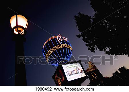 Stock Image - Nevada, Las Vegas, Paris Hotel And Casino, Street Lamp In Foreground, View From Below.. Fotosearch