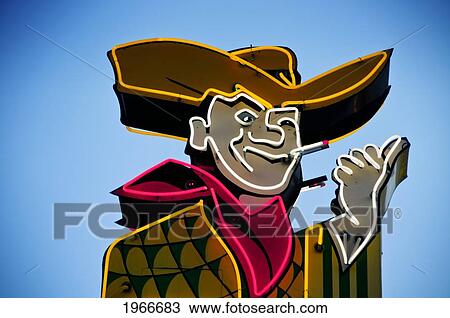 Stock Image - Nevada, Las Vegas, The Strip, Cowboy Neon Sign, Blue Sky. Editorial Use Only.. Fotosearch