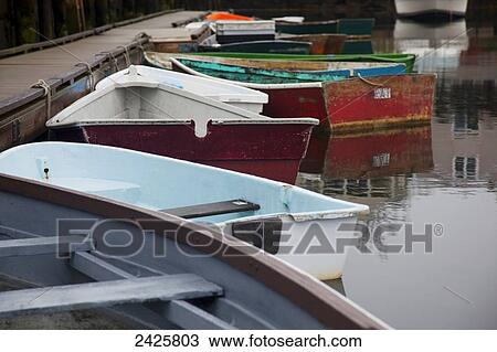 Stock Image - New England, Massachusetts, Close up of small wooden boats in the Rockport Harbor.. Fotosearch