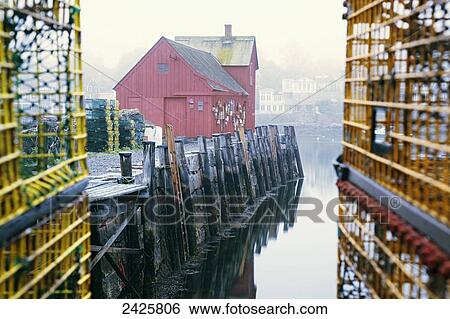 New England, Massachusetts, Red building at the end of Rockport Harbor, Framed by trap cages. View Large Photo Image Stock Photograph - New England, Massachusetts, Red building at the end of Rockport Harbor, Framed by trap cages.. Fotosearch