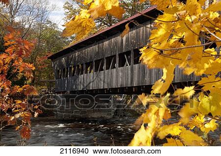 New England, New Hapshire, White mountains, A covered bridge over a river in Autumn. View Large Photo Image Stock Image - New England, New Hapshire, White mountains, A covered bridge over a river in Autumn.. Fotosearch