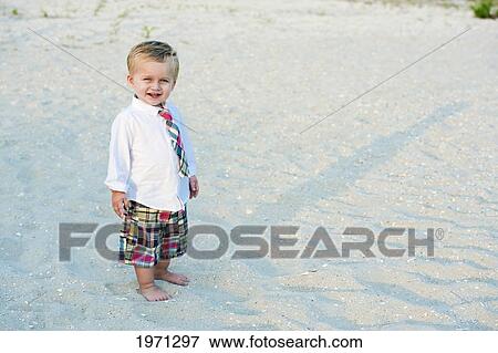 New Jersey, Ocean City, Young Boy Playing Along The Beach. View Large Photo Image Stock Photo - New Jersey, Ocean City, Young Boy Playing Along The Beach.. Fotosearch