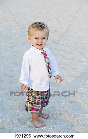 New Jersey, Ocean City, Young Boy Playing Along The Beach. View Large Photo Image Stock Photograph - New Jersey, Ocean City, Young Boy Playing Along The Beach.. Fotosearch