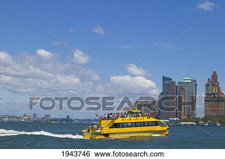 Stock Photograph - New York Water Taxi In The New York Harbor; New York City New York United States Of America. Fotosearch