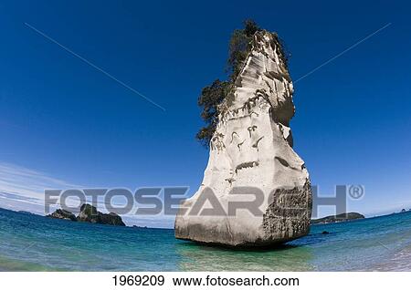 Stock Photo - New Zealand, North Island, Coromandel, Cathedral Cove, Sandstone Island Known Has 'te Hoho'.. Fotosearch