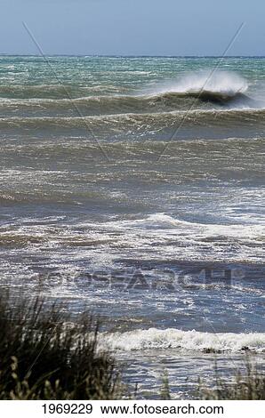 Stock Photo - New Zealand, North Island, Coromandel, Taranaki, Stormy Ocean Along Black Volcanic Beach.. Fotosearch