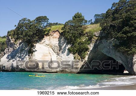 New Zealand, North Island, Coromandel, Cathedral Cove, Kayaker Paddling. View Large Photo Image Stock Photography - New Zealand, North Island, Coromandel, Cathedral Cove, Kayaker Paddling.. Fotosearch