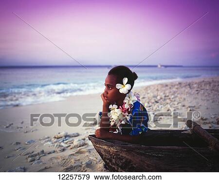 Ni-Vanuatu girl with canoe at sunset; Espiritu Santo, Vanuatu View Large Photo Image Stock Photo - Ni-Vanuatu girl with canoe at sunset; Espiritu Santo, Vanuatu. Fotosearch