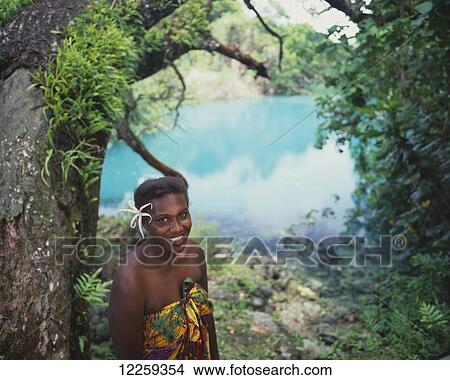Ni-Vanuatu woman with swimming hole in the background; Efate Island, Vanuatu View Large Photo Image Picture - Ni-Vanuatu woman with swimming hole in the background; Efate Island, Vanuatu. Fotosearch
