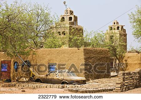 Stock Photo - Niger, Central Niger, Tahoa region, View of traditional mud brick village mosque in background; Yaama Village. Fotosearch