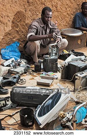 Niger, Man selling used electronics; Agadez View Large Photo Image Stock Image - Niger, Man selling used electronics; Agadez. Fotosearch