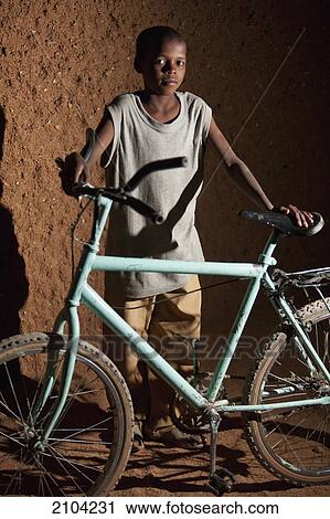 Niger, Sahara Desert, Agadez Region, Tuareg boy with bicycle; Agadez View Large Photo Image Stock Image - Niger, Sahara Desert, Agadez Region, Tuareg boy with bicycle; Agadez. Fotosearch