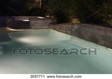 Night Lights In A Swimming Pool With A Waterfall; Palm Springs California United States Of America View Large Photo Image Stock Image - Night Lights In A Swimming Pool With A Waterfall; Palm Springs California United States Of America. Fotosearch