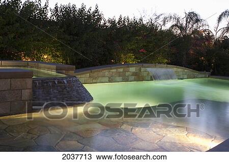 Night Lights Of A Pool With Waterfalls At Dusk; Palm Springs California United States Of America View Large Photo Image Stock Image - Night Lights Of A Pool With Waterfalls At Dusk; Palm Springs California United States Of America. Fotosearch
