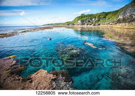 Stock Photography - Niue Island's rugged coastline; Niue. Fotosearch