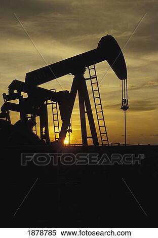 Nodding Donkey Oil Wells In Silhouette View Large Photo Image Stock Photography - Nodding Donkey Oil Wells In Silhouette. Fotosearch