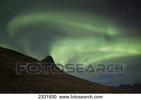 Northern Lights (Aurora Borealis) Over Kirkjufell In The Town Of Grundarfjorthur, Snaefellsness Peninsula; Grundarfjorthur, Iceland View Large Photo Image Stock Image - Northern Lights (Aurora Borealis) Over Kirkjufell In The Town Of Grundarfjorthur, Snaefellsness Peninsula; Grundarfjorthur, Iceland. Fotosearch