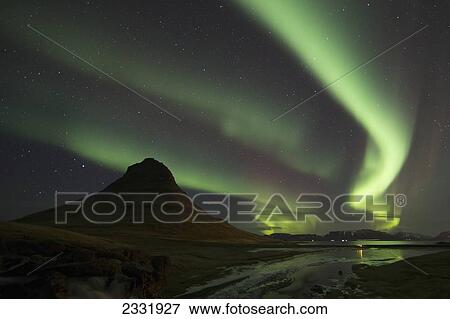 Northern Lights (Aurora Borealis) Over Kirkjufell In The Town Of Grundarfjorthur, Snaefellsness Peninsula; Grundarfjorthur, Iceland View Large Photo Image Stock Photo - Northern Lights (Aurora Borealis) Over Kirkjufell In The Town Of Grundarfjorthur, Snaefellsness Peninsula; Grundarfjorthur, Iceland. Fotosearch