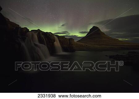 Northern Lights Or Aurora Borealis Over Kirkjufell In The Town Of Grundarfjorthur, Snaefellsness Peninsula; Grundarfjorthur, Snaefellsness, Iceland View Large Photo Image Stock Photo - Northern Lights Or Aurora Borealis Over Kirkjufell In The Town Of Grundarfjorthur, Snaefellsness Peninsula; Grundarfjorthur, Snaefellsness, Iceland. Fotosearch