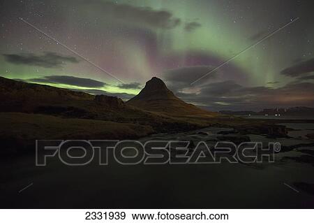 Stock Photo - Northern Lights Or Aurora Borealis Over Kirkjufell In The Town Of Grundarfjorthur, Snaefellsness Peninsula; Grundarfjorthur, Snaefellsness, Iceland. Fotosearch