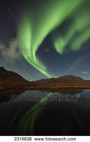 Northern Lights Reflected In A Small Pond Along The Dempster Highway; Yukon Canada View Large Photo Image Stock Photo - Northern Lights Reflected In A Small Pond Along The Dempster Highway; Yukon Canada. Fotosearch