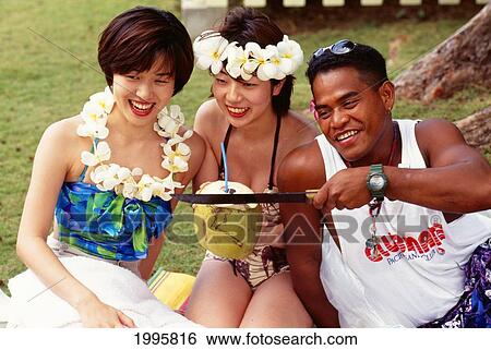 Northern Marianas, Saipan, Pacific Island Club Resort, Clubmate Lawrence With Japanese Guests Drinking From Coconut View Large Photo Image Stock Photograph - Northern Marianas, Saipan, Pacific Island Club Resort, Clubmate Lawrence With Japanese Guests Drinking From Coconut. Fotosearch
