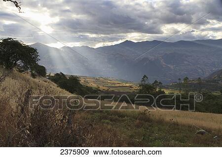 Stock Photo - Northern Mountain Range of Peru at the headwaters of the Jequetepeque River, as seen from Kuntur Wasi, Cajamara, Peru. Fotosearch