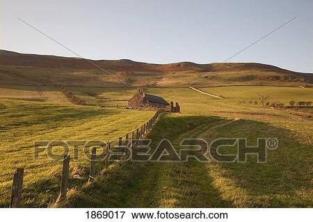 Northumberland, England; A Farm Structure And A Fence Around A Field View Large Photo Image Stock Photo - Northumberland, England; A Farm Structure And A Fence Around A Field. Fotosearch