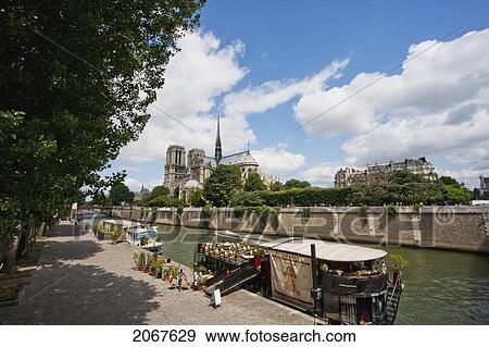 Notre Dame De Paris Cathedral, As Seen From The Left Bank Of The Seine, Paris, France View Large Photo Image Stock Photo - Notre Dame De Paris Cathedral, As Seen From The Left Bank Of The Seine, Paris, France. Fotosearch