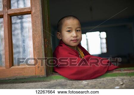 Novice monk at Rumtek Monastery; Gangtok, Sikkim, India View Large Photo Image Picture - Novice monk at Rumtek Monastery; Gangtok, Sikkim, India. Fotosearch