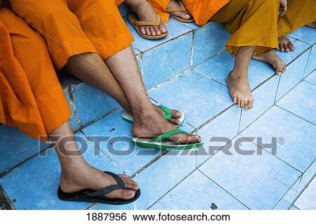 Novice Monks Sitting On The Steps Of Wat Sensoukharam. View Large Photo Image Stock Photograph - Novice Monks Sitting On The Steps Of Wat Sensoukharam.. Fotosearch