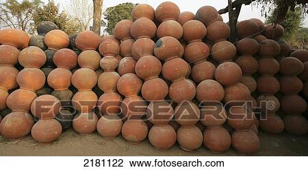 Stock Image - Numerous ceramic pots in a pile, Potters Village; Madhya Pradesh, India. Fotosearch