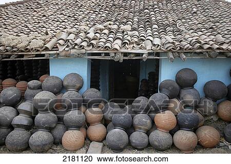Numerous ceramic pots piled outside a blue house, Potters Village; Madhya Pradesh, India View Large Photo Image Stock Image - Numerous ceramic pots piled outside a blue house, Potters Village; Madhya Pradesh, India. Fotosearch
