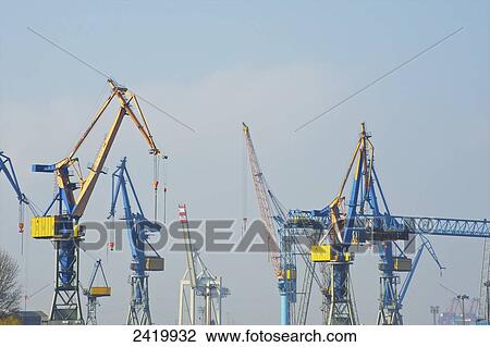 Numerous cranes in the smog filled sky; Hamburg, Germany View Large Photo Image Stock Image - Numerous cranes in the smog filled sky; Hamburg, Germany. Fotosearch
