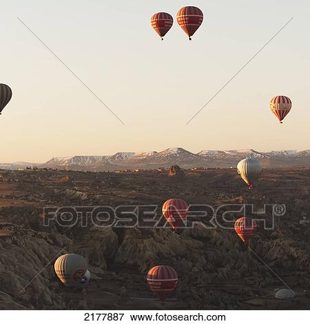 Stock Photo - Numerous Hot Air Balloons In The Sky; Goreme Nevsehir Turkey. Fotosearch