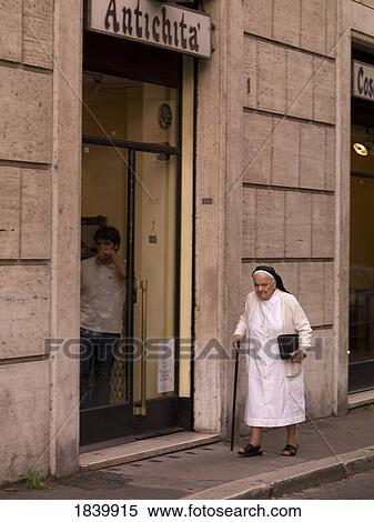 Nun Walking Down The Street; Rome, Italy View Large Photo Image Stock Photography - Nun Walking Down The Street; Rome, Italy. Fotosearch