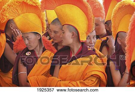 Nuns / Monks In Traditional Dress With Yellow Orange Hats And Robes Praying At 800 Year Old Birthday Celebration / Rituals Of The Buddhist Drukpa Lineage, Naro Photang Shey, (Shey Monastery), Leh Ladakh, Indian Himalayas, India View Large Photo Image Stock Photo - Nuns / Monks In Traditional Dress With Yellow Orange Hats And Robes Praying At 800 Year Old Birthday Celebration / Rituals Of The Buddhist Drukpa Lineage, Naro Photang Shey, (Shey Monastery), Leh Ladakh, Indian Himalayas, India. Fotosearch