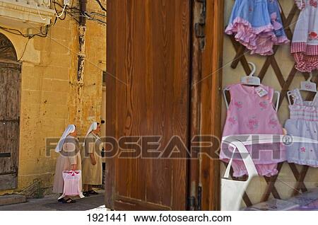 Stock Image - Nuns With Shopping Bags. Fotosearch