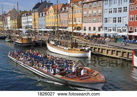 Nyhavn Canal, Copenhagen, Denmark; Tour Boat On A Canal View Large Photo Image Stock Photo - Nyhavn Canal, Copenhagen, Denmark; Tour Boat On A Canal. Fotosearch