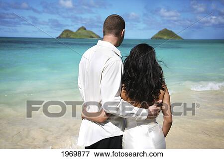 Oahu, Hawaii, Lanikai, Young Couple Both Holding Eachother. View Large Photo Image Stock Photo - Oahu, Hawaii, Lanikai, Young Couple Both Holding Eachother.. Fotosearch