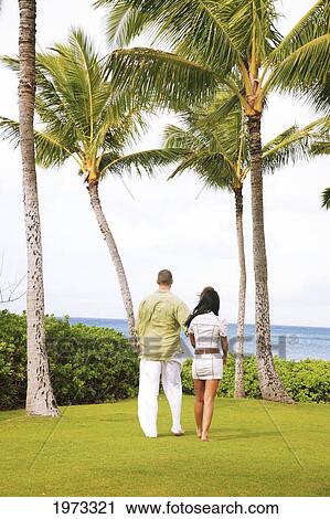 Oahu, Hawaii, Young Couple Both Holding Eachother. View Large Photo Image Stock Image - Oahu, Hawaii, Young Couple Both Holding Eachother.. Fotosearch