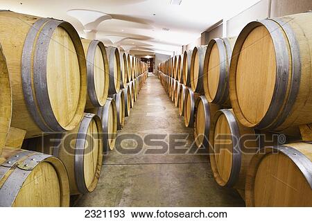 Stock Image - Oak Wine Barrels In A Wine Cellar; Niagara-On-The-Lake Ontario Canada. Fotosearch